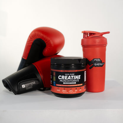 Feel More Energy creatine monohydrate jar with boxing gloves and gym equipment — engineered for serious strength athletes