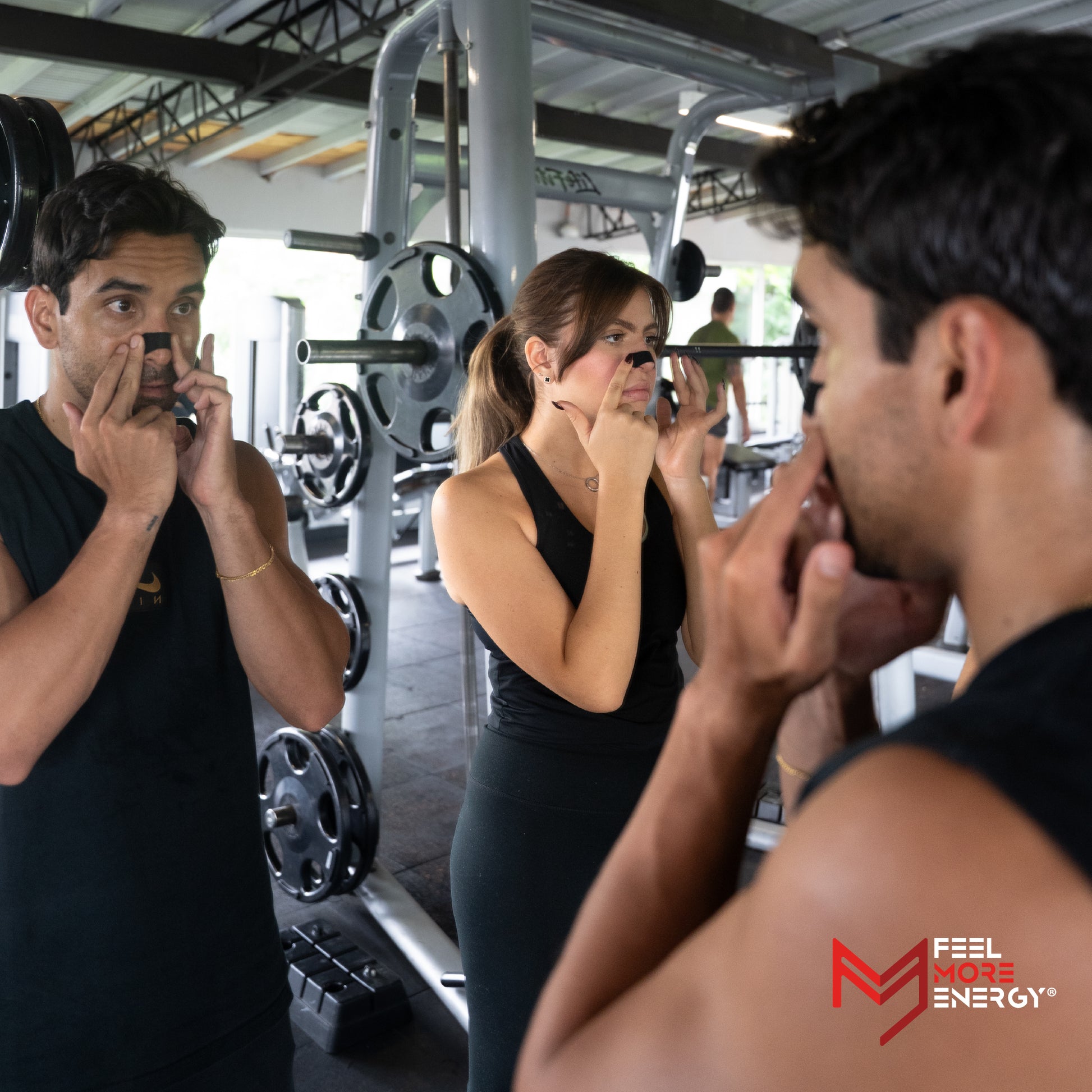 Two people in a gym setting with 'Feel the Energy' logo visible.