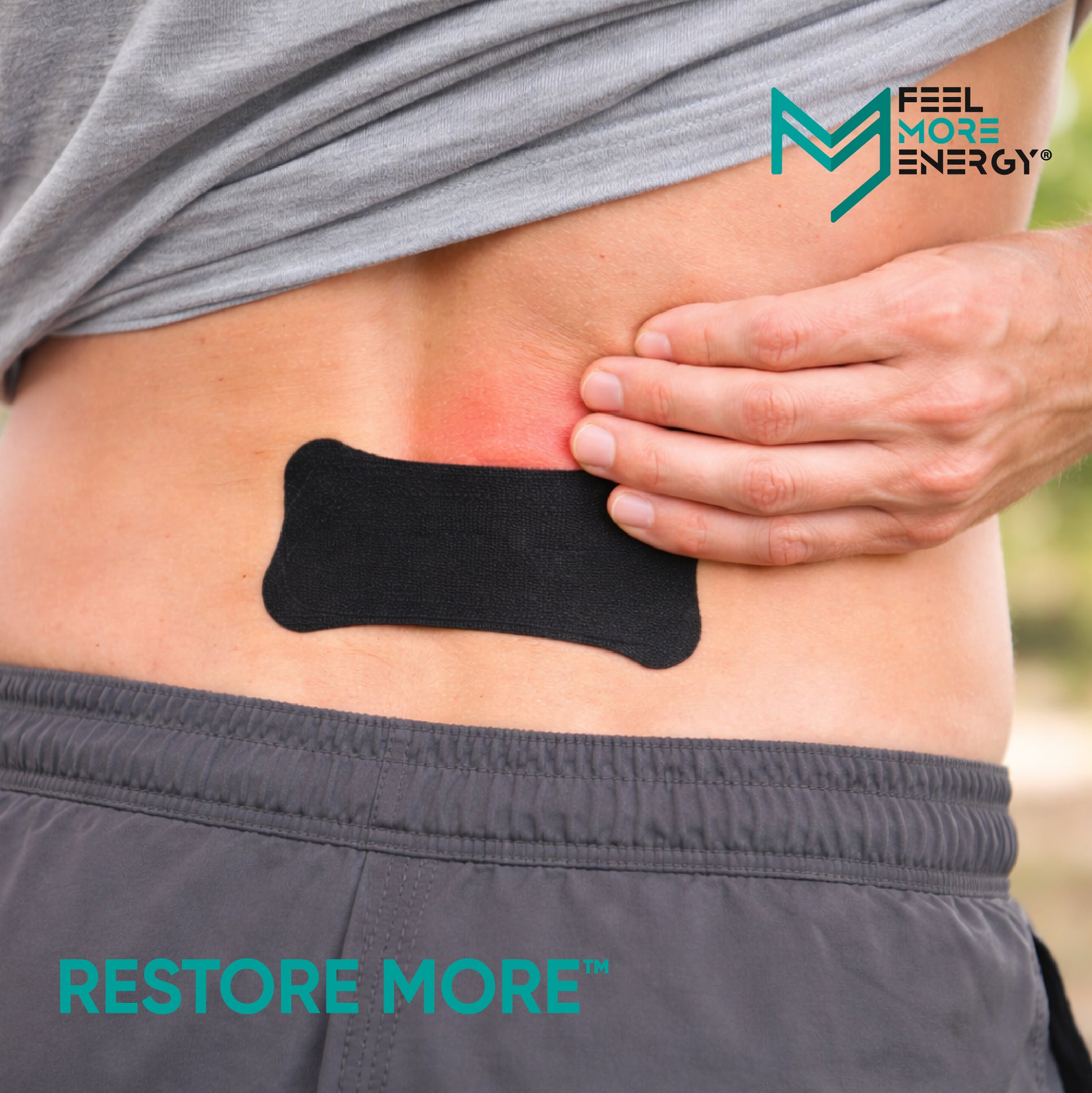 Person wearing a black adhesive patch on their back with 'Feel More Energy' branding.