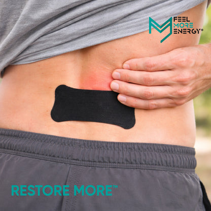 Person wearing a black adhesive patch on their back with 'Feel More Energy' branding.