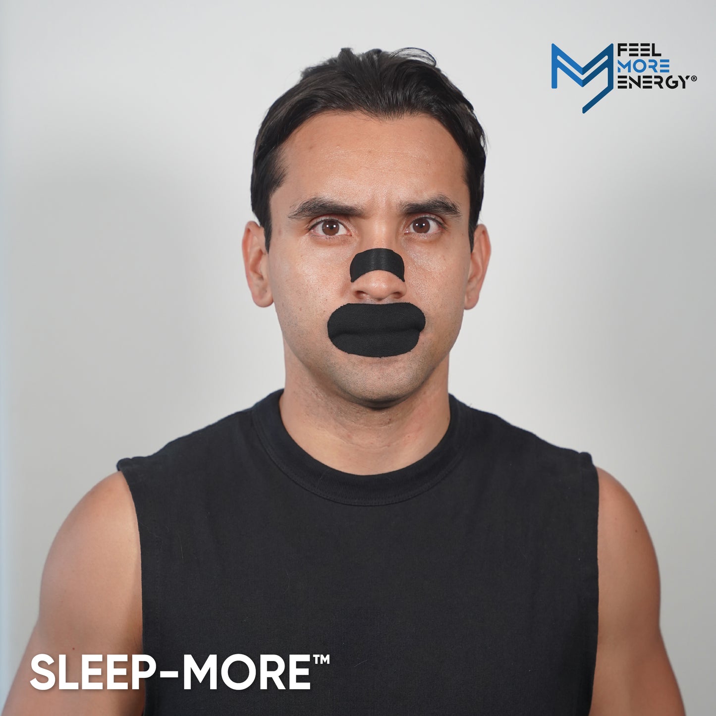 Man wearing a black Sleep-More nose mask against a plain background with the brand logo visible.